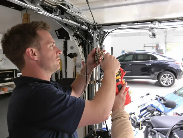 Bellingham Garage Door Repair safety certified technician performing cable replacement in Bellingham