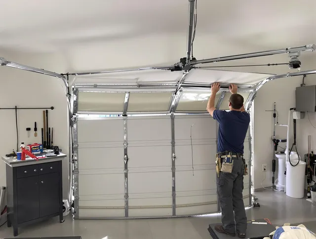 Bellingham Garage Door Repair specialist performing precise section replacement on Bellingham garage door